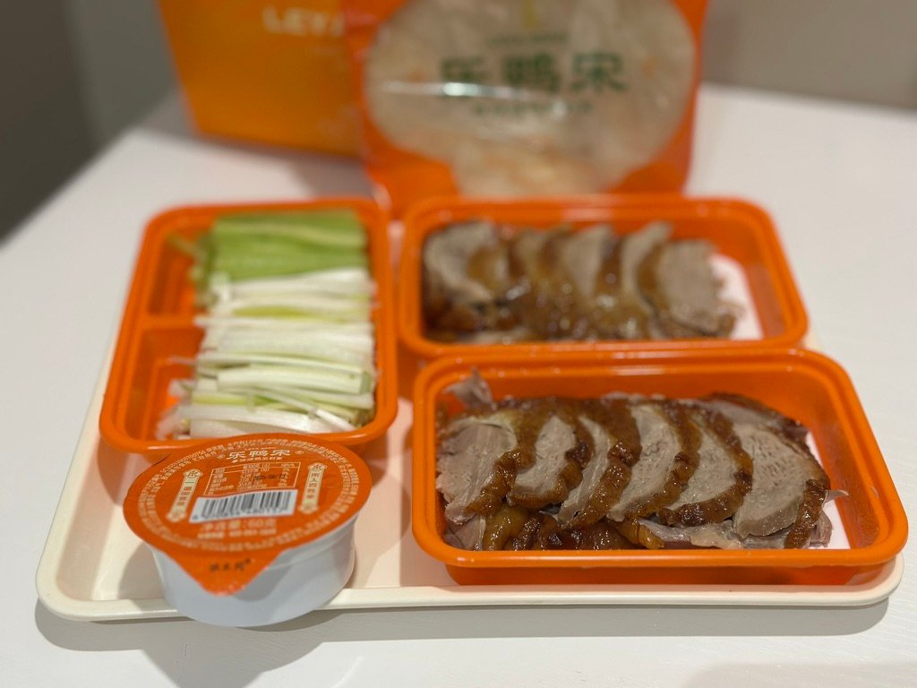 Unpacking birthday food delivery at Beijing hotel